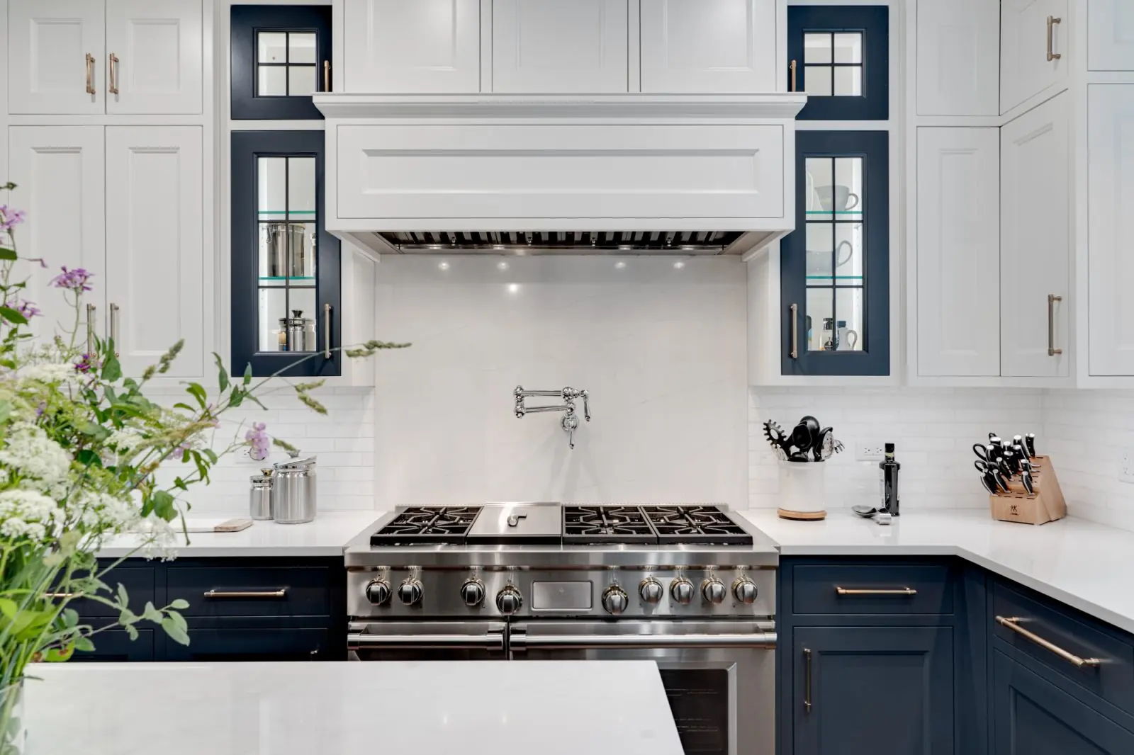 Kitchen remodel with navy and white custom cabinetry